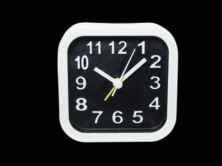 isolated the white and black clock on black background