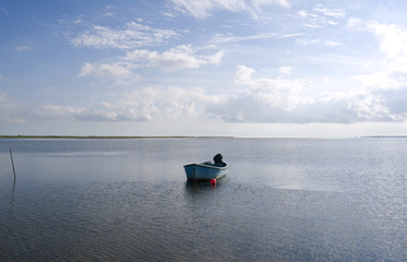 Laesoe / Denmark: Small fishing boat in the bay at Bloeden Hale