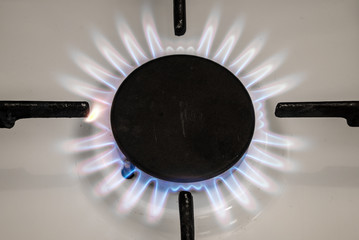 Gas stove flame on kitchen. Blue fire flame from stove.