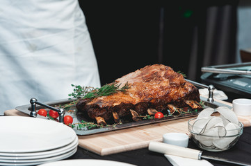 Homemade bone-in prime rib roast on wooden plank