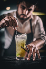 Bartender is stirring cocktail