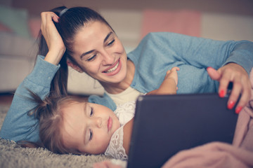 Mother an daughter at home.