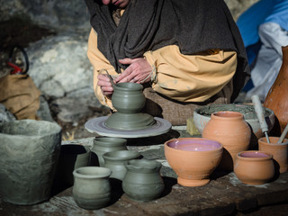 Craftsman at work to make a clay pot.
