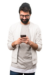 Happy Hipster man talking to mobile on white background