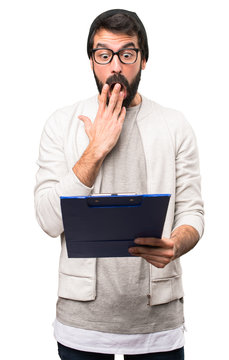 Surprised Hipster man with folder on white background