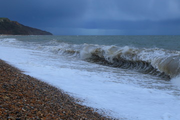 Rainy on a pebble beach near town of Seaton in Devon on the Jurassic Coast