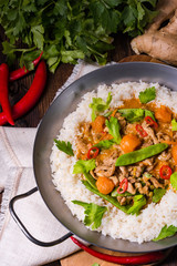 wok pan with meat strips and vegetables