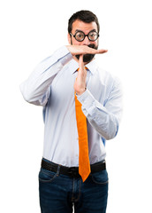 Funny man with glasses making time out gesture