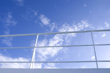 Seafaring: Deck railing on a RoRo vessel in front of the sky