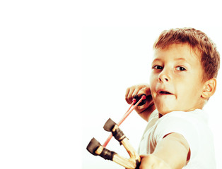 little cute angry real boy with slingshot isolated