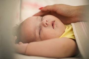 Mother with baby at home.