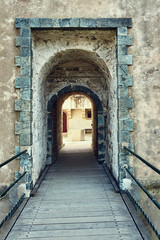 Fototapeta na wymiar wooden bridge and gate of the medieval fortifications in Saint Tropez