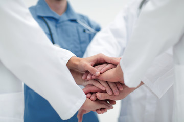 closeup.Small group of doctor team joining hands,