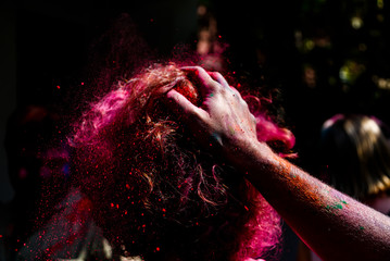 People playing at Holi festival in India with colors