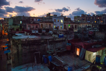 Night landscape. Top view of the street, on ordinary houses with roofs and balconies, where clothes dry. Havana. Cuba