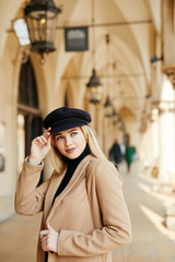 Obraz premium Young pretty girl walking on the street and smile