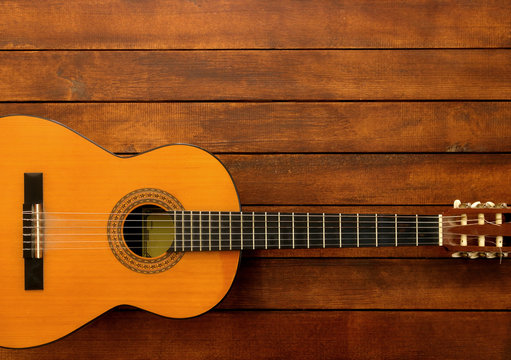 Guitar on the Wooden Background