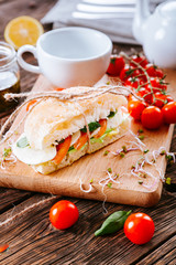 Sandwich with tomato, cheese and  lettuce