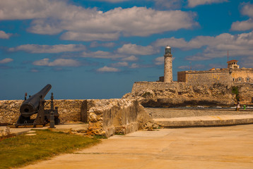 The old colonial castle of San Salvador de la Punta. Gun at the walls of the ruined. Castillo Del Morro lighthouse. Havana, Cuba.