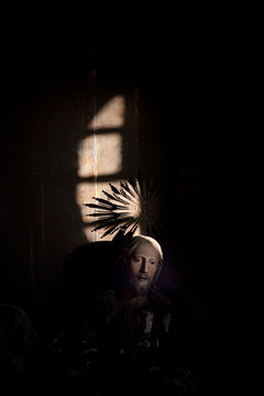 Statue of christ and crown in sunlight