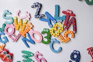 Colourful messed up magnet letters