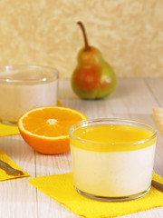 Food. Panna cotta. Milk fruit dessert made of yoghurt and cream with pear and orange.