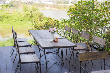 Empty cafe table with chair in vintge coffee shop