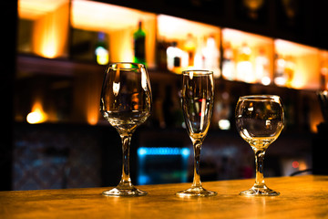 Transparent glasses on the bar in the club