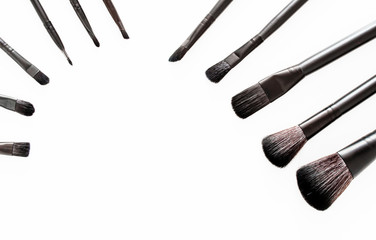 brushes for makeup on a white background, view from above