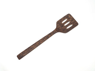 Wooden spade or flipper for frying pan isolated on white background.