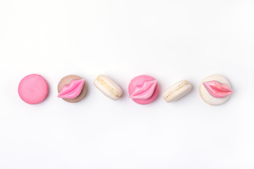 Obraz na płótnie Canvas French Colorful Macarons Colorful Pastel Macarons on White Background Pink Brown White Macaron
