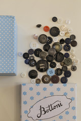 close-up of buttons of various colors and measures on a table