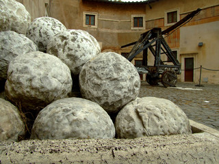 closeup of ancient medieval catapult with stones