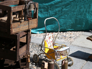 image of an ancient stroller for children at the market