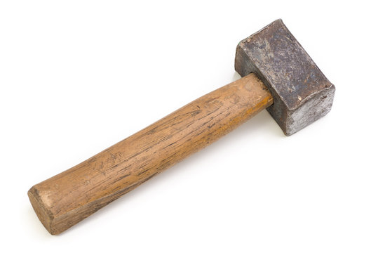 Close up of a heavily used old hammer isolated on white.