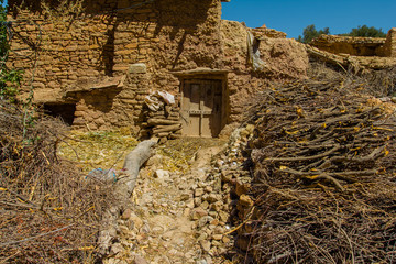 Small clay building with brushwood on mountain Morocco, Africa.