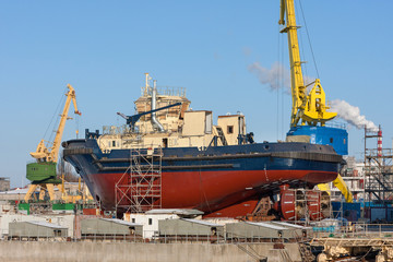 Fototapeta na wymiar Tow-boat is being built in a dry dock