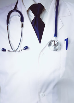 Medical doctor with a stethoscope standing in office