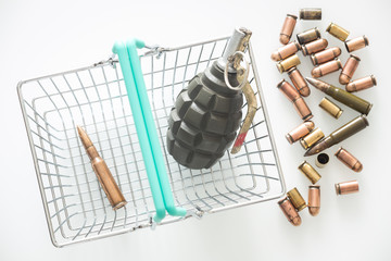 Arms trade, Shopping basket with grenade, concept