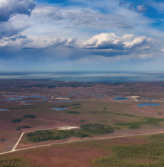 Oil field on swamp, top view