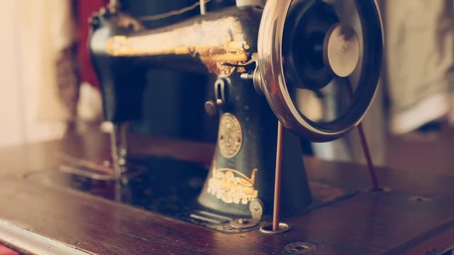 Close up of vintage sewing machine. Retro style sewing tinted footage