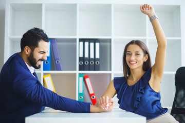 Business people woman and man arm wrestling