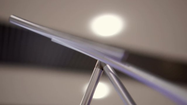 the iron balancing pendulum from metal. Close up. The balancing pendulum from iron sticks