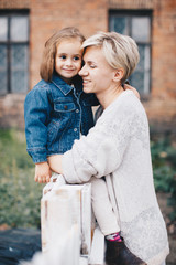 happy mother and daughter in park