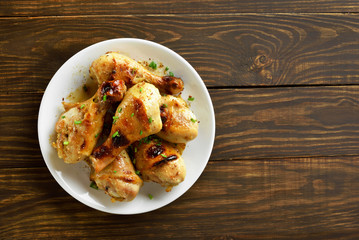 Chicken drumstick on white plate