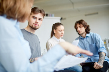 Fototapeta premium Business people working in team. They are reading a report and preparing for meeting