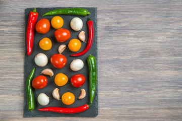 Fresh vegetables on wooden background top view. Copy-space.