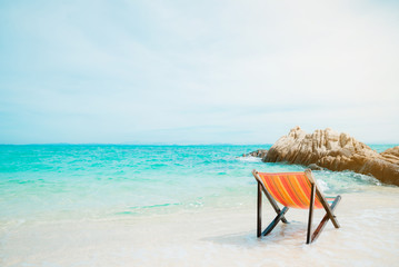 Fototapeta na wymiar Beach chair at sunny day