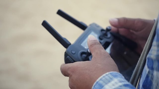Operate the drone, press the levers and buttons. HD, 1920x1080. slow motion