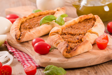 Turkish pide pizza with meat and onion. 